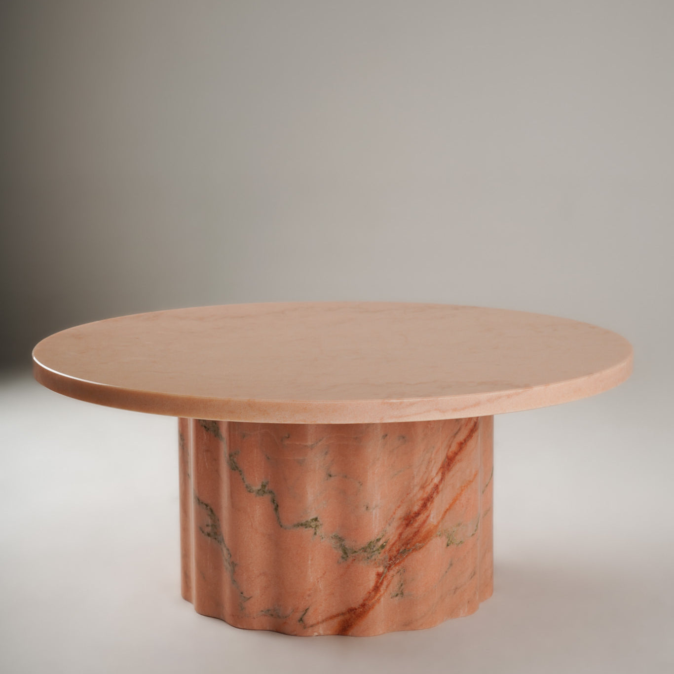 Stine Coffee Table 01 – round Rosa Aurora marble table with sculptural wavy base, front view