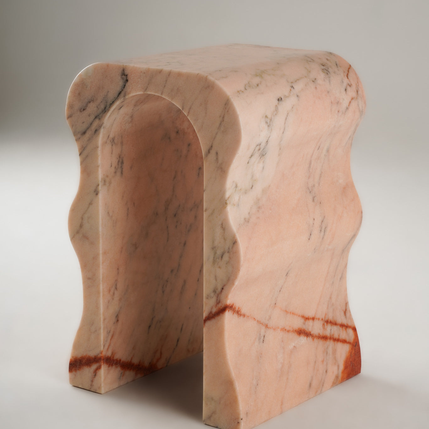 Stine Stool 01 in Rosa Aurora marble – curved sculptural legs, full product view