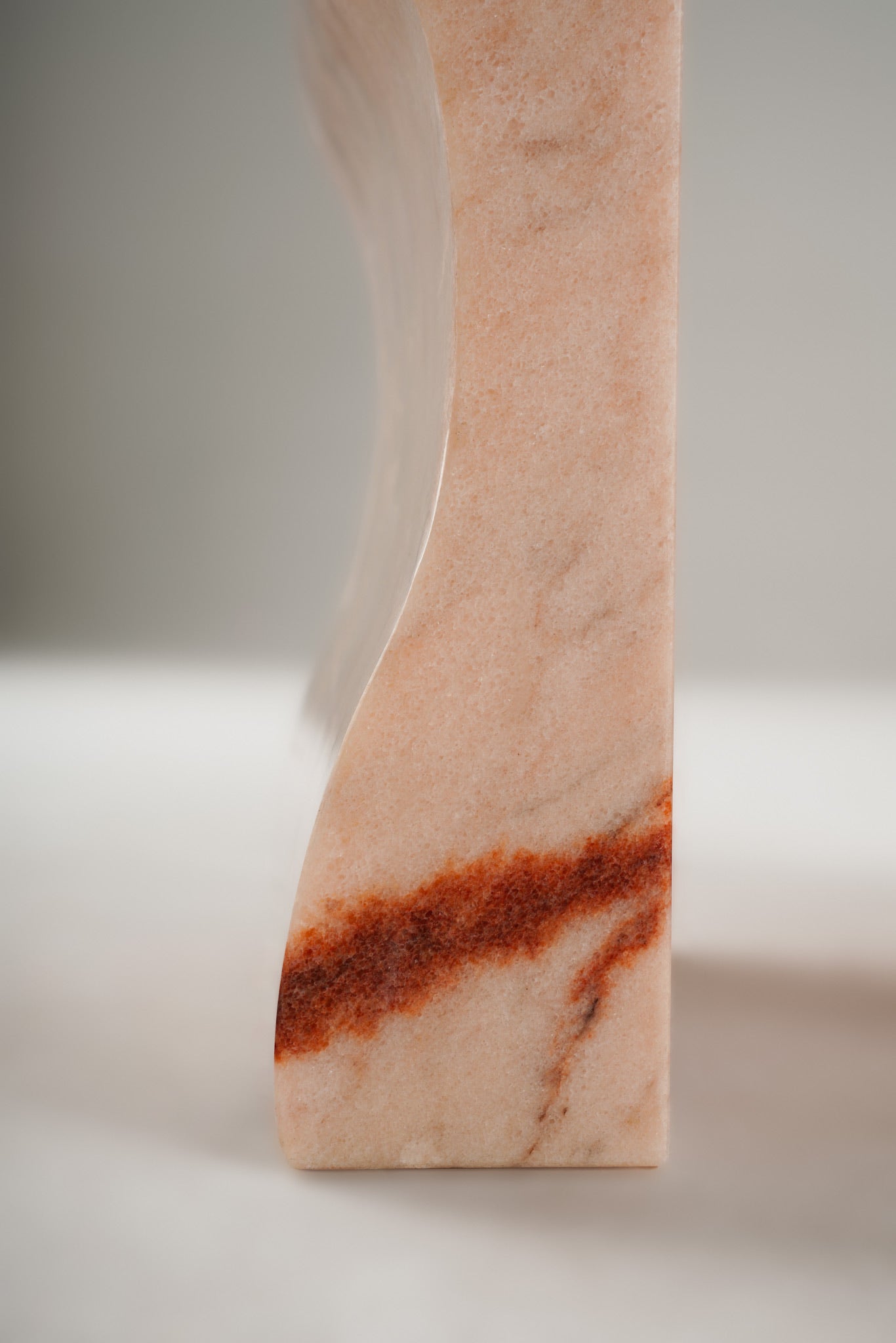 Leg surface detail of Stine Stool 01 – polished Rosa Aurora marble