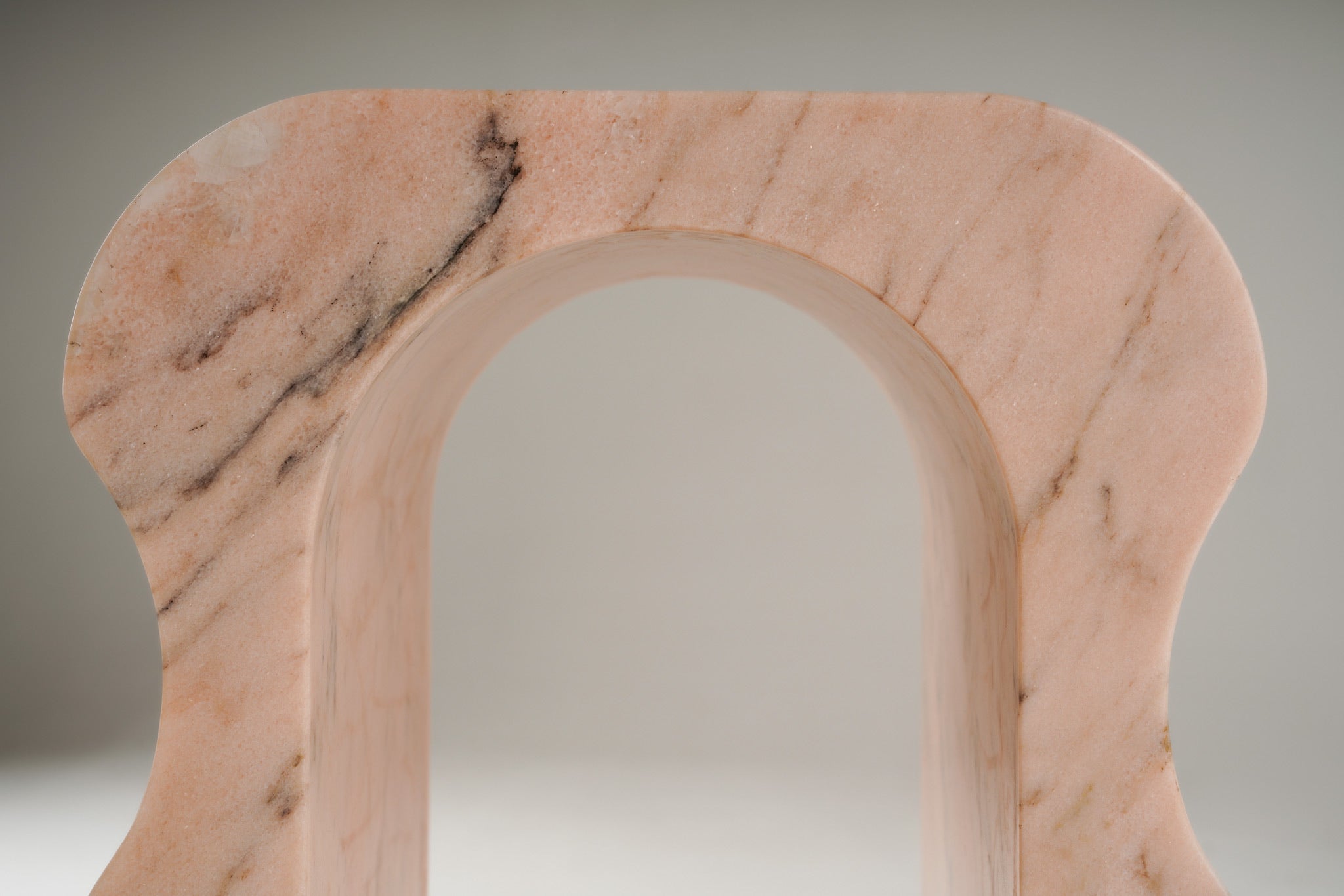 Top surface detail of Stine Stool 01 – polished Rosa Aurora marble